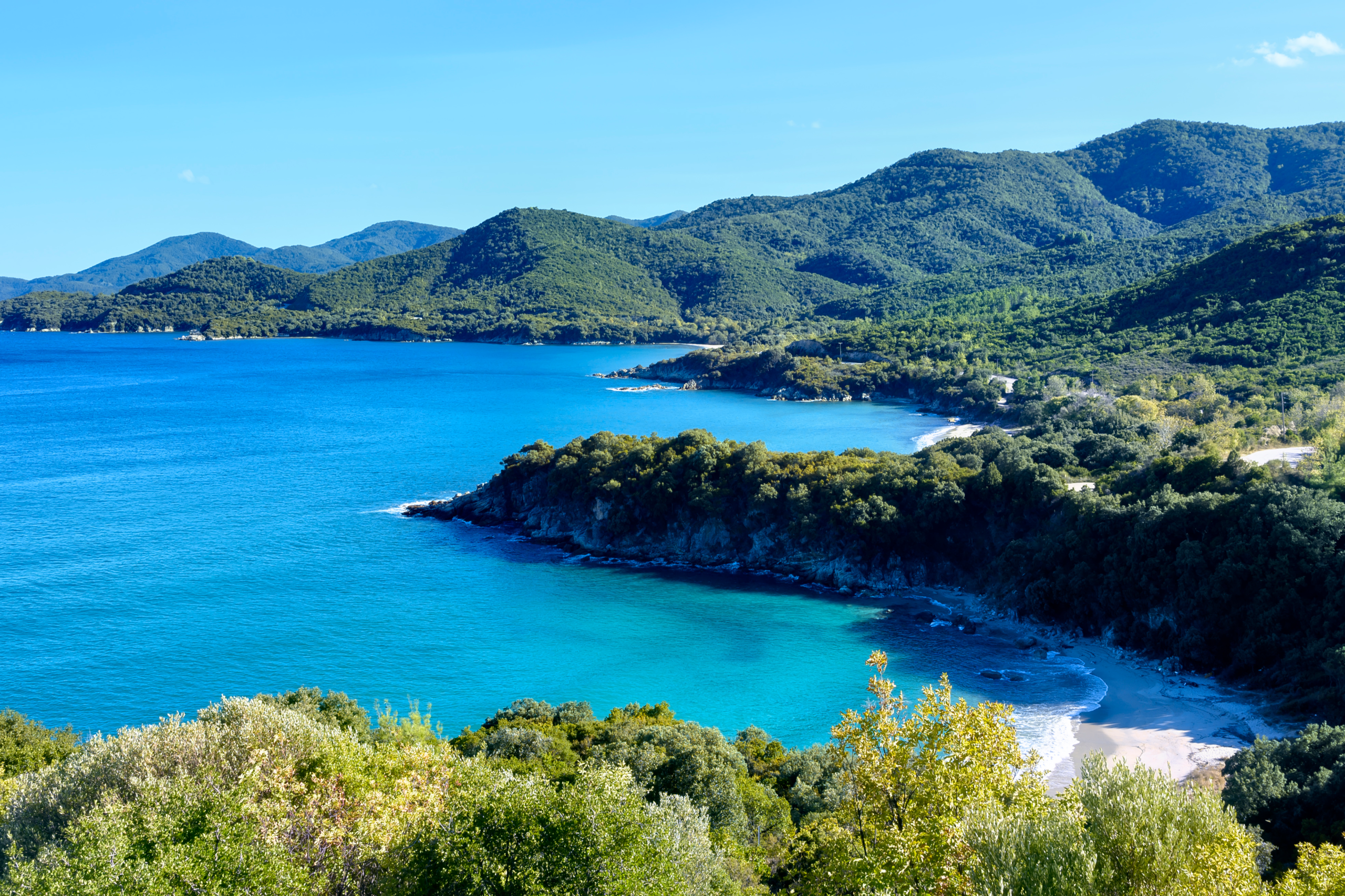 Green mountains and blue sea at Olympiada, Halkidiki, Greece